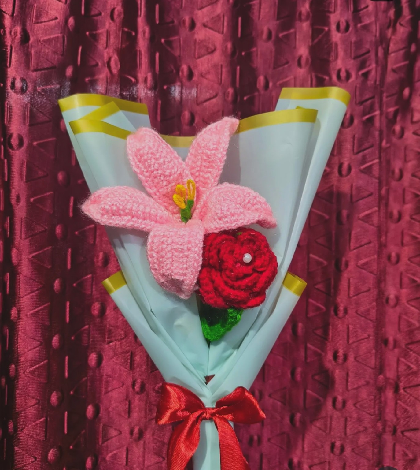 Pink lily bloom and crimson rose accent mini bouquet with red ribbon