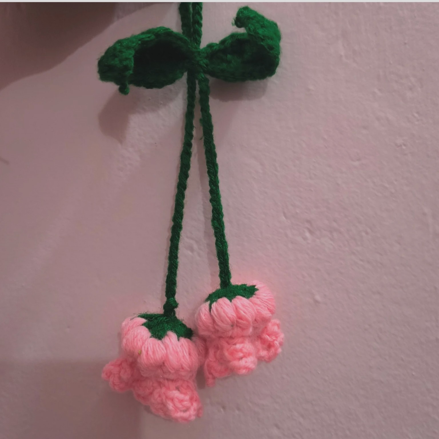 Handmade crochet floral hanging wall decor with vine bow and twin pink blossom bells