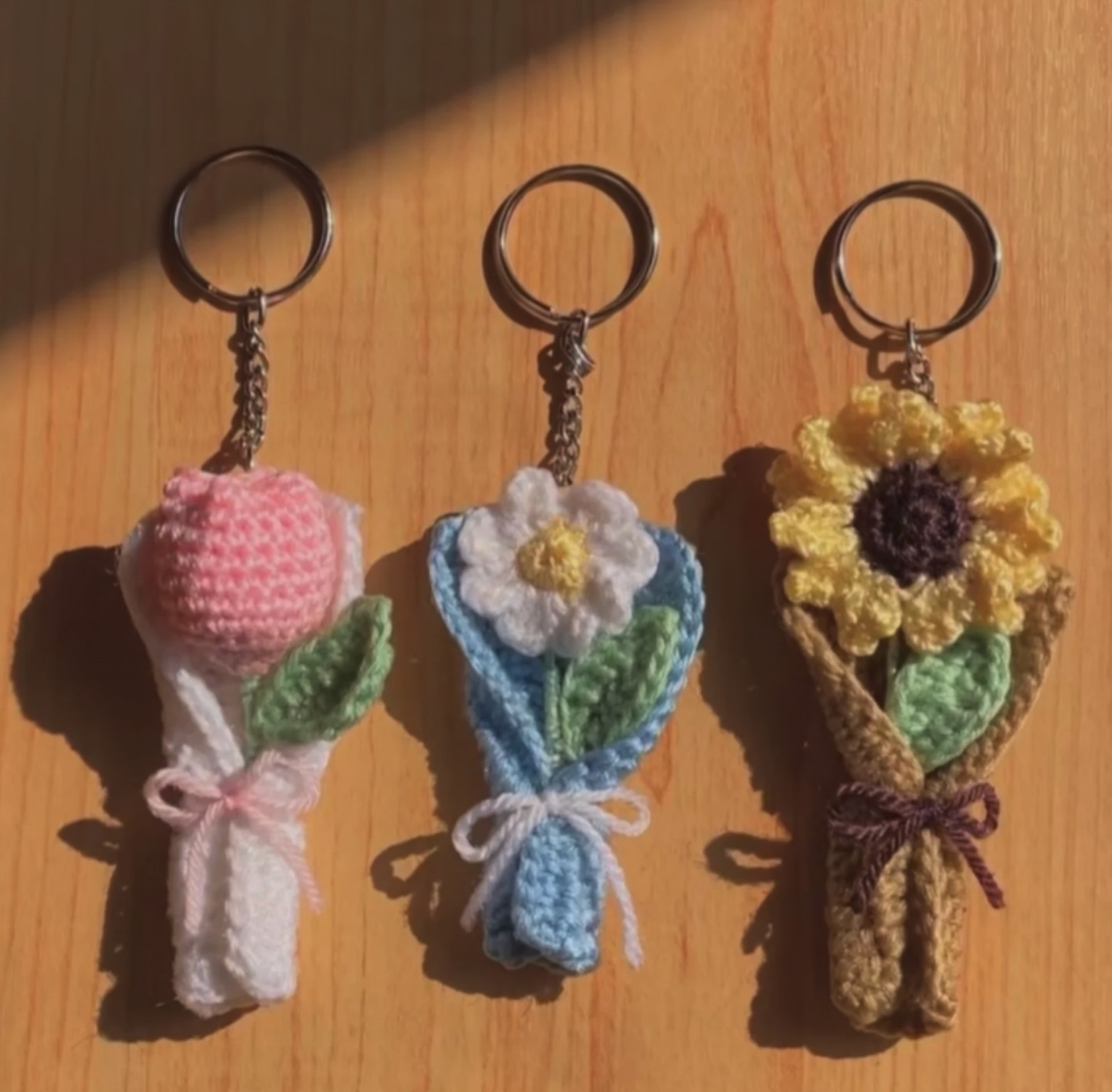 Charming mini bouquet keychains handcrafted with mini tulip, daisy, and sunflower stems